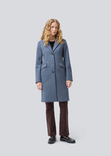 Beautiful, long wool coat. Pamela coat is closed by 3 big buttons at front and is waisted, which gives a feminine look. Because of the high content of wool you will be able to keep warm all through fall and the mild winters. The model is 176 cm and wears a size S/36