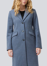 Beautiful, long wool coat. Pamela coat is closed by 3 big buttons at front and is waisted, which gives a feminine look. Because of the high content of wool you will be able to keep warm all through fall and the mild winters. The model is 176 cm and wears a size S/36