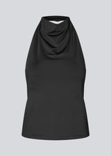 Fitted halterneck top without sleeves. Parissamd top has draped details at the front and an open back.