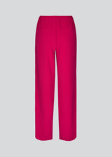 Pink pants in a simple design with wide legs. Perry pants have pockets at side seam and an elasticated waistline for a comfortable fit. The model is 173 cm and wears a size S/36