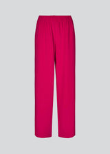 Pink pants in a simple design with wide legs. Perry pants have pockets at side seam and an elasticated waistline for a comfortable fit. The model is 173 cm and wears a size S/36