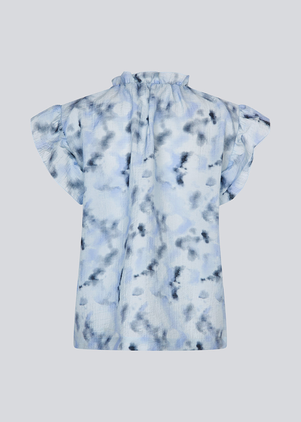 Sleeveless top with ruffled details. Phillipsmd print top has a v-neck with a button closure and ruffles at the neck and sleeves.