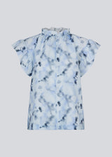 Sleeveless top with ruffled details. Phillipsmd print top has a v-neck with a button closure and ruffles at the neck and sleeves.