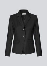 Slightly fitted blazer with a v-neck. Piloumd blazer has two front pockets and a slit at the sleeve with button closure.