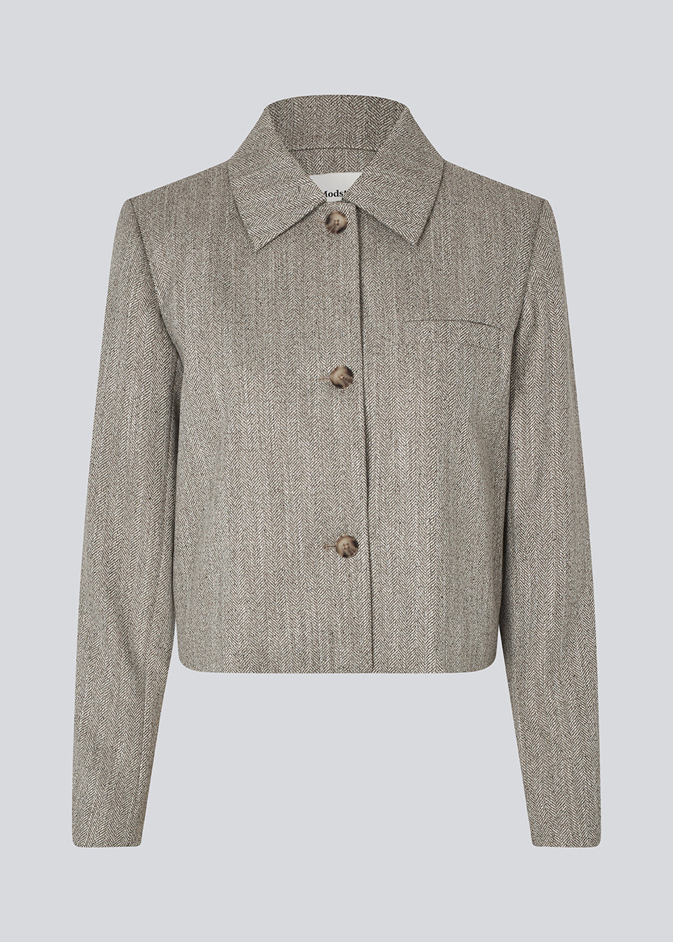 Short jacket with a shirt collar and front button closure. Popemd jacket has long sleeves with slits and a chest pocket. The model is 175 cm and wears a size S/36.