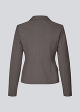 Grey short fitted blazer. Primrosemd blazer has a button closure and two front pockets. The model is 175 cm and wears a size s/36.