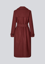 Classic, double-breasted wool coat with collar and notch lapels. ShayMD coat has a wide tiebelt at waist, shoulder straps, wide cuffs and open yoke. With lining and single back vent.