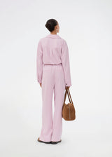 Suit pants in light pink with wide legs. The Sophiemd pants feature a zipper, belt loops, and a relaxed fit – a feminine, modern look that’s perfect with a t-shirt or knit.