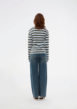 Form-fitting polo with thick blue and green stripes and a chest logo. The Stetsonmd polo has a collar, long sleeves and button closure at the chest. A stylish polo shirt that stands out and lifts both suit trousers and jeans to a sharp look.