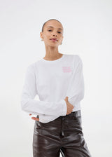 Long-sleeved white T-shirt in 100% organic cotton with "Out of Office" print on the chest. The Sugarmd LS shirt is a casual but cool choice for everyday life with the quote in a fresh pink color.