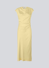 Sleeveless maxi dress with pleats in the side. TailorMD dress is made in satin and has a high neck, invisible zipper in the back and a slit in the side seam.