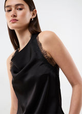 Elegant and sophisticated top. TamalMD top is designed with graceful draping and delicate lace details that create a feminine and exclusive look. Perfect for both evening wear and styling with a modern, fashion-forward touch.