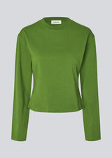 Light cropped T-shirt in soft 100% organic cotton. The TampaMD T-Shirt features a round neckline, long sleeves, and a fitted silhouette - a sleek and trendy wardrobe essential, perfect for layering or casual looks.