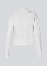 Slightly cropped long-sleeved t-shirt in white in 100% organic cotton. Tampamd LS t-shirt has a round neck and a fitted look.