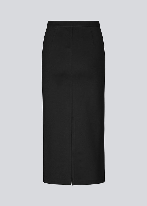 Long pencil skirt in jersey with a figure-hugging fit. TannyMD long skirt has a high waist with covered elastication and a slit at center back. 