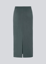 Long pencil skirt in jersey with a figure-hugging fit. TannyMD long skirt has a high waist with covered elastication and a slit at center back. The model is 175 cm and wears a size S/36.