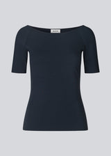Tansy top in navy noir has a simple look with a wide neckline at front and back and narrow sleeves. The top is slim fit without being tight.