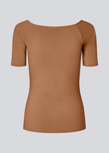 Tansy top has a simple look with a wide neckline at front and back and narrow sleeves. The top is slim fit without being tight.