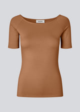 Tansy top has a simple look with a wide neckline at front and back and narrow sleeves. The top is slim fit without being tight.