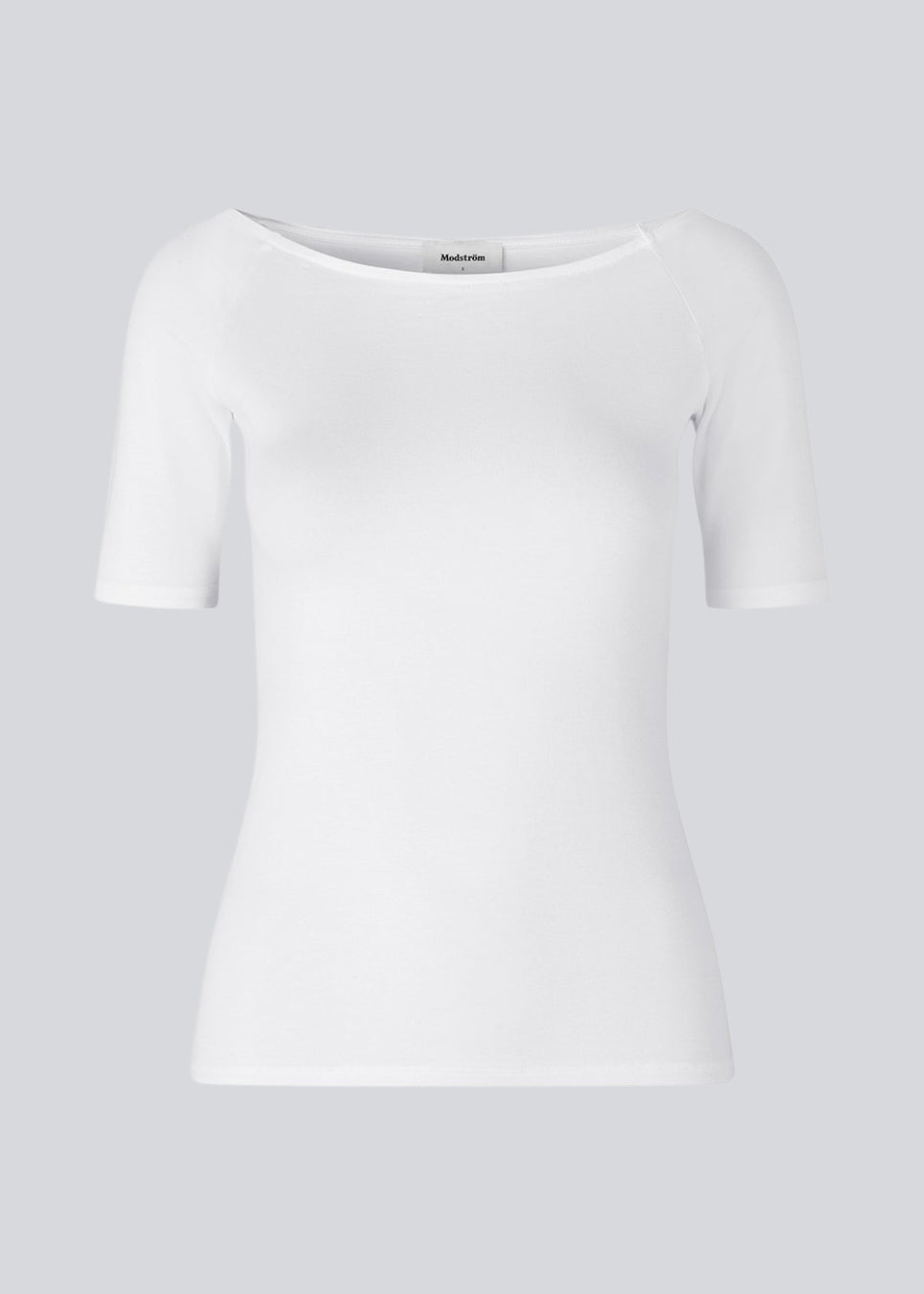 Tansy top in white has a simple look with a wide neckline at front and back and narrow sleeves. The top is slim fit without being tight.