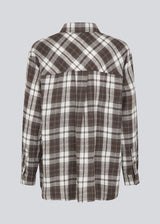 Classic oversize shirt in flannel in brown. TappoMD shirt has a chest pocket, button closure in front and a manchet with button closure. 