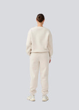 Sweatpants with logo in a cotton mixture. TiaMD pants has sidepockets, tieband and an elastic in the bottom and waist.