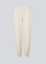 Sweatpants with logo in a cotton mixture. TiaMD pants has sidepockets, tieband and an elastic in the bottom and waist.