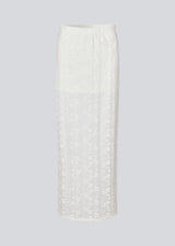 Maxi skirt in a white see-through lace material. TildeMD skirt has a lining and an elastic waistband.