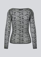 Fitted top in dark green in a see-through lace material. TildeMD top has long sleeves and a wider neckline. 