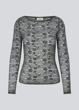 Fitted top in dark green in a see-through lace material. TildeMD top has long sleeves and a wider neckline. 