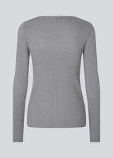 Fine knit cardigan with a v-neck. TomMD cardigan has long sleeves and a button closure in front.