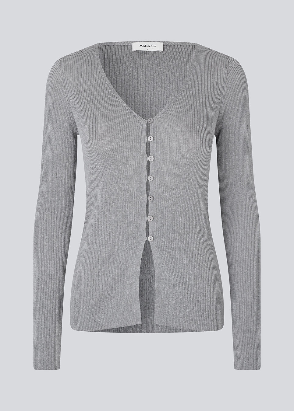 Fine knit cardigan with a v-neck. TomMD cardigan has long sleeves and a button closure in front.
