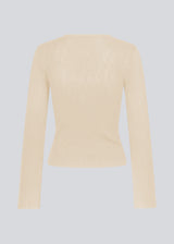 Fine knit jumper in summer sand in a drapy quality. TomMD o-neck has a slightly cropped length with long, flared sleeves. Ribknit on neckline and hem.