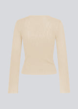 Fine knit jumper in summer sand in a drapy quality. TomMD o-neck has a slightly cropped length with long, flared sleeves. Ribknit on neckline and hem. 