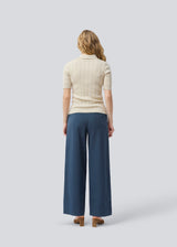 Soft knittet polo in 100% organic cotton. ToniaMD SS polo has short sleeves and a placket with 4 buttons.