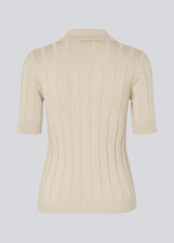 Soft knittet polo in 100% organic cotton. ToniaMD SS polo has short sleeves and a placket with 4 buttons.
