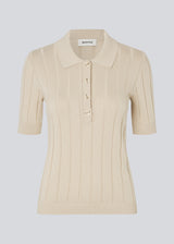 Soft knittet polo in 100% organic cotton. ToniaMD SS polo has short sleeves and a placket with 4 buttons.