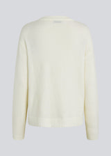 Loose off white knit in plain jersey knit. TreeMD o-neck has a round neckline and long loose sleeves.