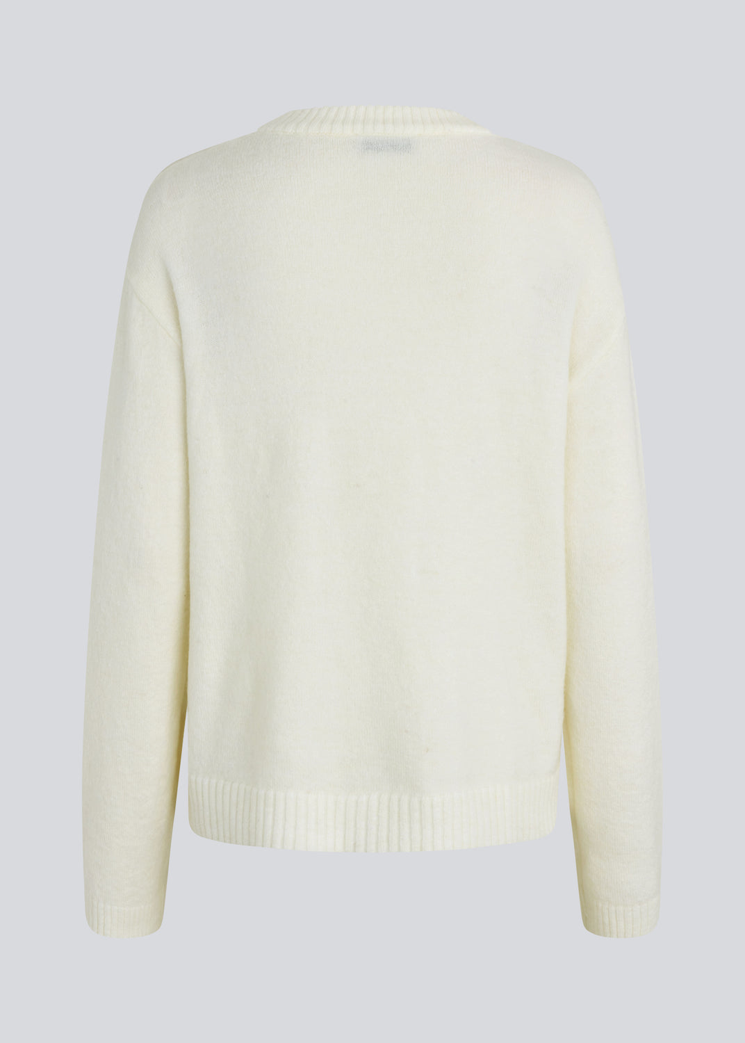 Loose off white knit in plain jersey knit. TreeMD o-neck has a round neckline and long loose sleeves.