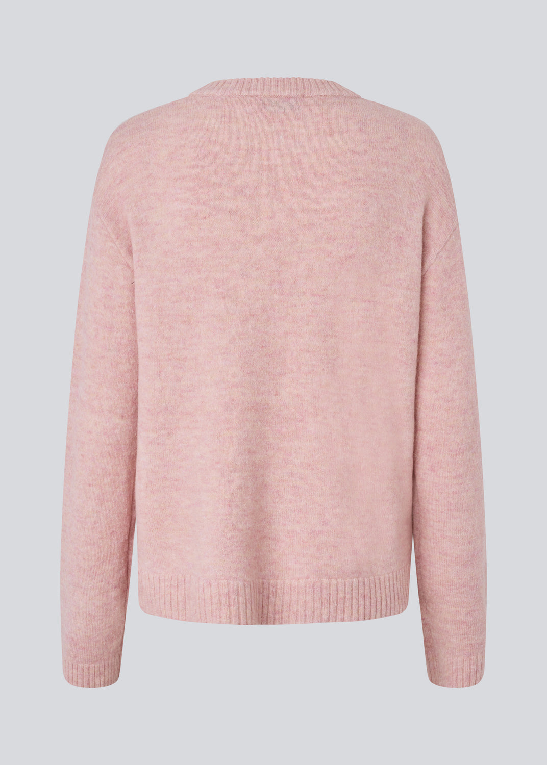 Loose knit in a light rose color in plain jersey. TreeMD o-neck has a round neckline and long loose sleeves.