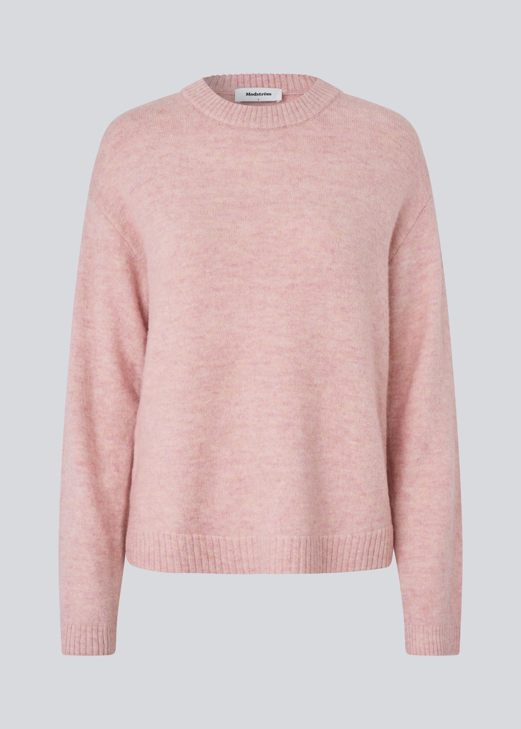 Loose knit in a light rose color in plain jersey. TreeMD o-neck has a round neckline and long loose sleeves.