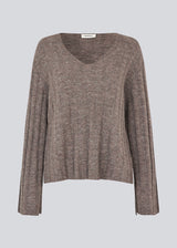 Soft knit in brown with long sleeves and a V-neckline.  Treemd V-neck has a loose fit and a slit at the sleeve. 