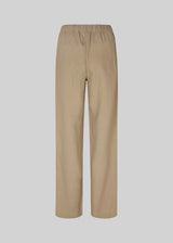 Long pants in the color Dune with a relaxed fit and long wide legs and elasticated waist for extra comfort. TulsiMD pants are made from a soft mix of linen and rayon. The model is 177 cm and wears a size S/36.