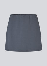 Short flared skirt in a stretchy material in dark blue. TurnerMD flare skirt has an elastic waistband. Match the skirt with the top: TurnerMD tank top.