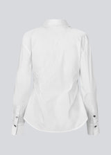 A modern interpretation of the classic shirt in white. The UllisMD Shirt is made from 97% organic cotton and designed with a pointed collar, half button closure, and a feminine, fitted silhouette that creates an elegant and sophisticated look. The model is 175 cm and wears a size S/36.
Material:
97% Organic Cotton
3% Elastane
