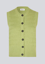 Knitted sleeveless top in green made from 100% organic cotton. The UlvaMD Top is crafted in a beautiful herringbone knit with a wide ribbed hem and trim. The contrast buttons and round neckline give the top a refined and feminine look. The model is 175 cm and wears a size S/36.
Material:
100% Organic Cotton