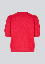 Feminine knit sweater in red with short sleeves and a subtle puff. The UzziMD SS O-neck features a round neckline and delicate ribbed trims, creating an elegant and timeless look. The model is 175 cm and wears a size S/36.
Material:
76% Acrylic
24% Polyester