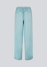 Elegant trousers in lightweight, lustrous satin. The Valdomd pants feature a loose and comfortable fit with an adjustable drawstring at the waist for a relaxed yet sophisticated look. Made from 98% recycled polyester.