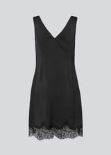 Short black satin dress with lace details. Vuemd dress features wide straps, a crossed detail lace at the bust, lace at the bottom, and a hidden side zip. Elegant and feminine – ideal for both everyday wear and special occasions.