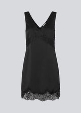 Short black satin dress with lace details. Vuemd dress features wide straps, a crossed detail lace at the bust, lace at the bottom, and a hidden side zip. Elegant and feminine – ideal for both everyday wear and special occasions.